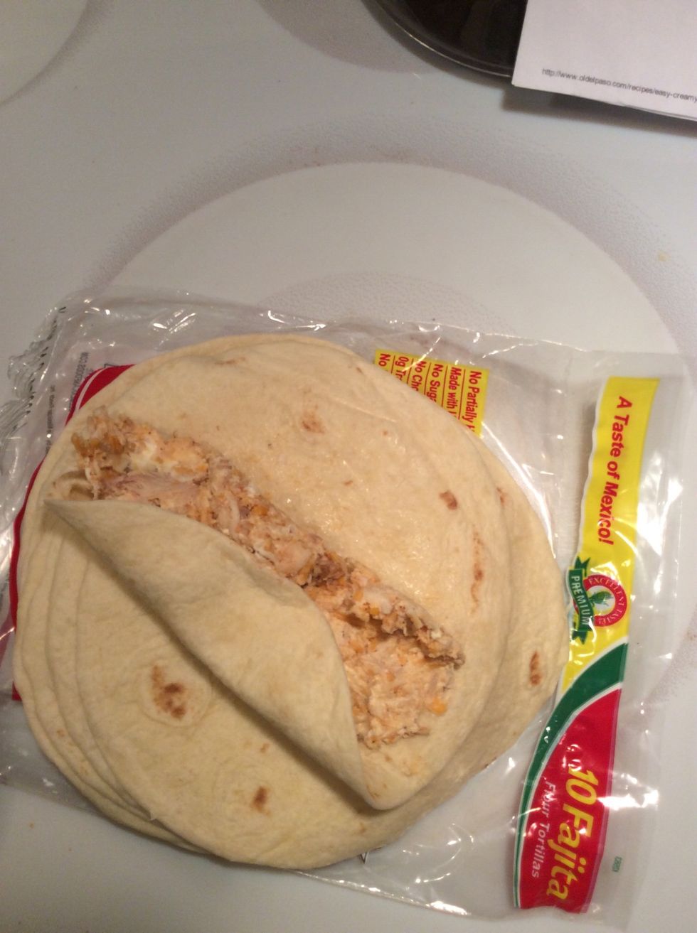 Spoon 2 spoonfuls into each tortilla and wrap them.