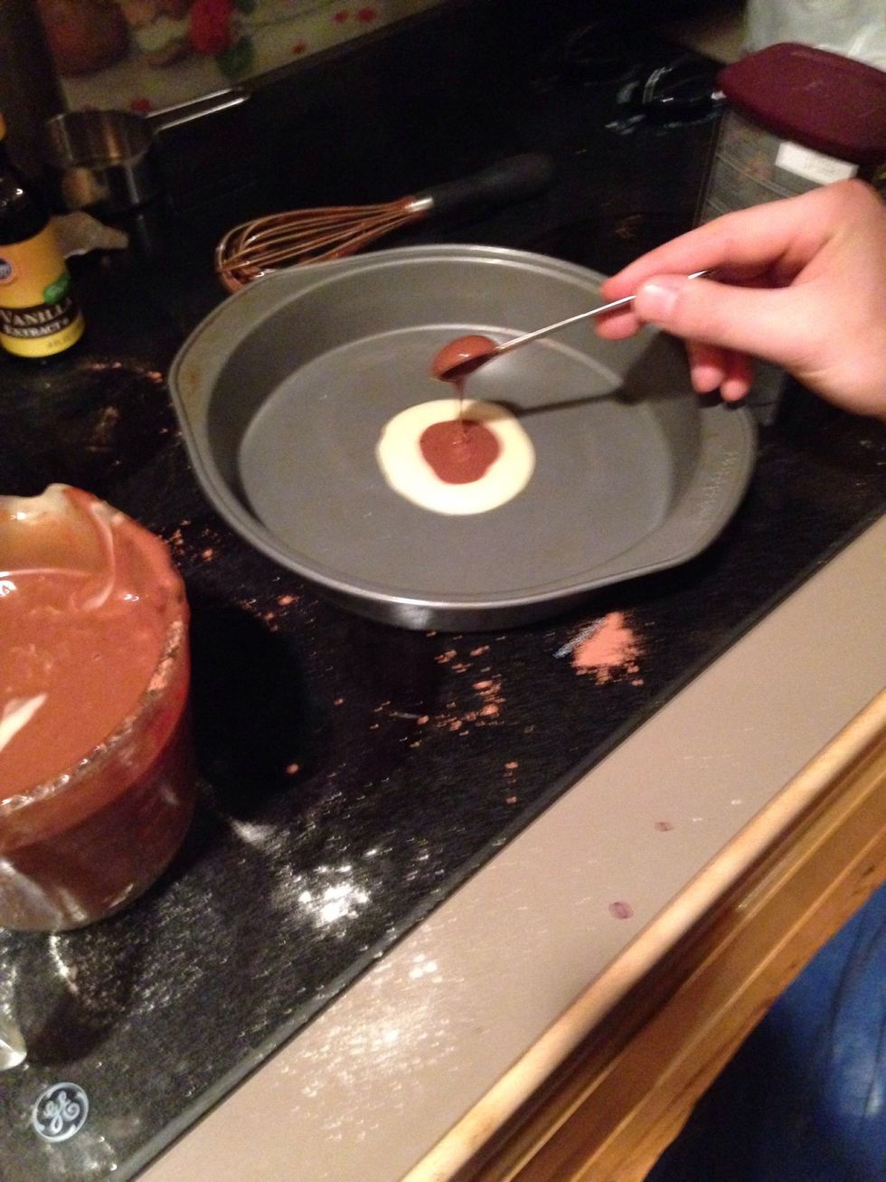Spoon 3 tablespoons of chocolate batter into the center of the vanilla batter