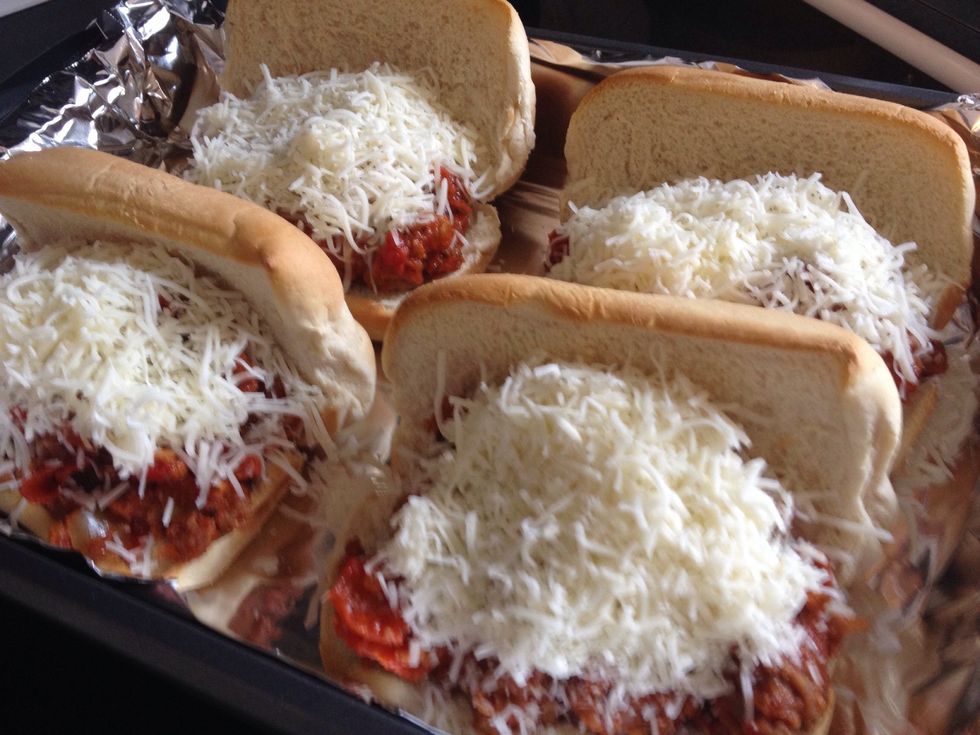 Spoon a generous helping of the meat mixture into each of the buns. Pile the shredded mozzarella on top of that.