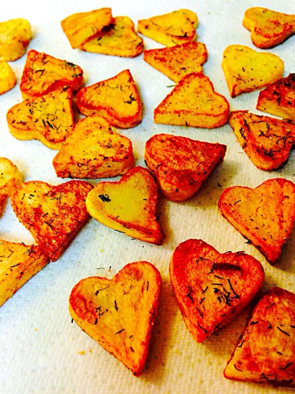 Spoon all hearts and place on paper towel to absorb the oil