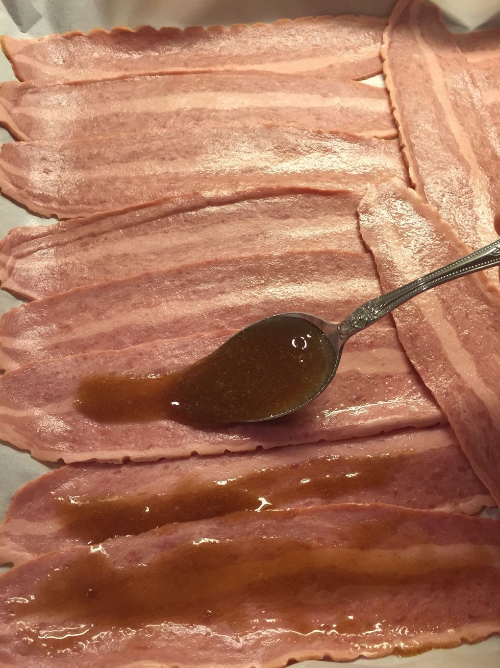 Spoon brown sugar mixture over top of bacon.