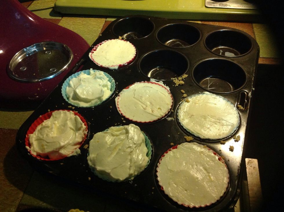 Spoon cheesecake mix onto set biscuit bases. Fill to the top.