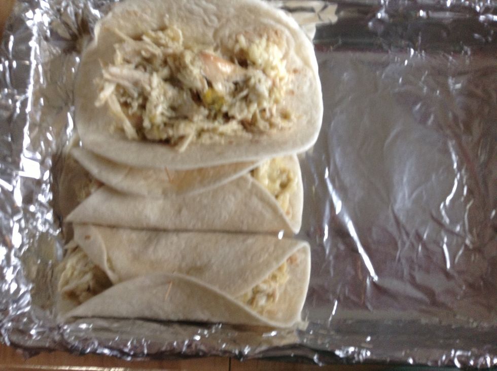Spoon chicken mix into small flour tortillas