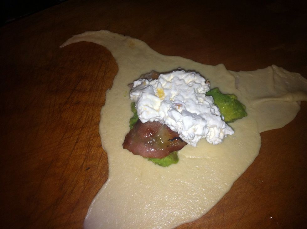 Spoon cream cheese mixture onto crescent rolls.