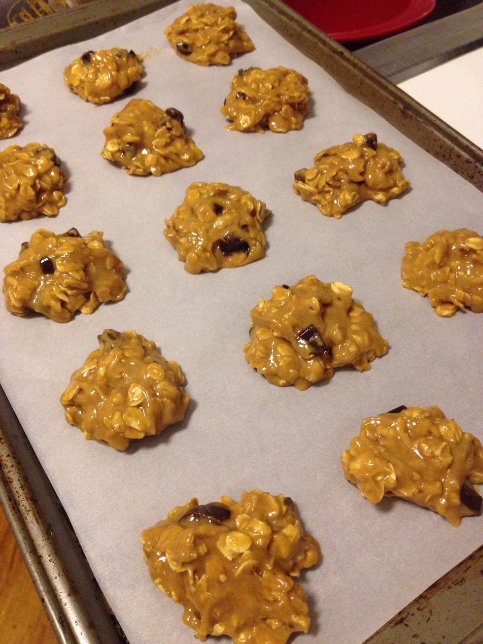 Spoon dough onto parchment lined cookie sheet and bake in preheated oven for 9-11 minutes or until sides are slightly browned.