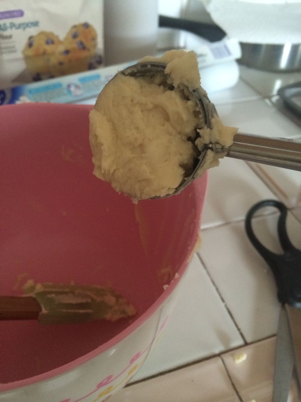 Spoon dough onto parchment lined cookie sheets with a small ice cream scoop