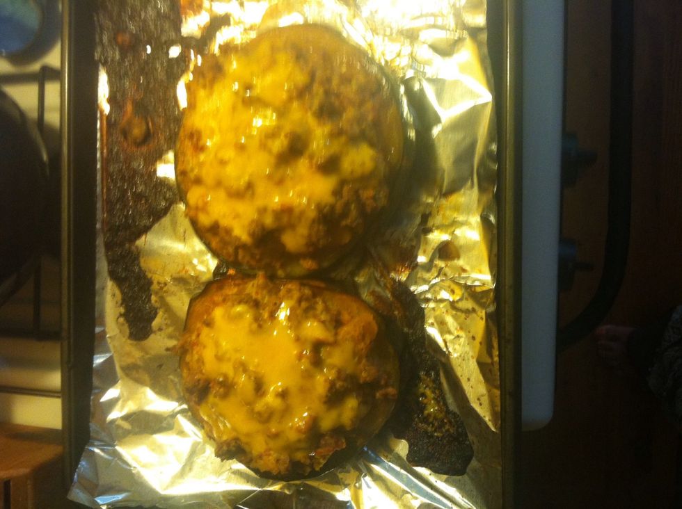 Spoon into squash and bake for 15 mins on 350 sprinkle with cheese and bake for 3-5 more mins. Let rest 10 mins before serving.