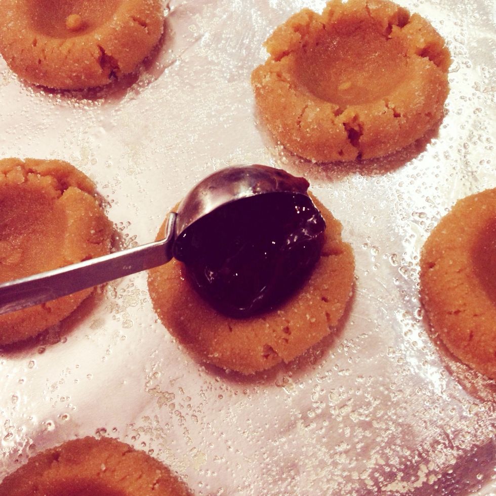 Spoon jelly into each of the centers.