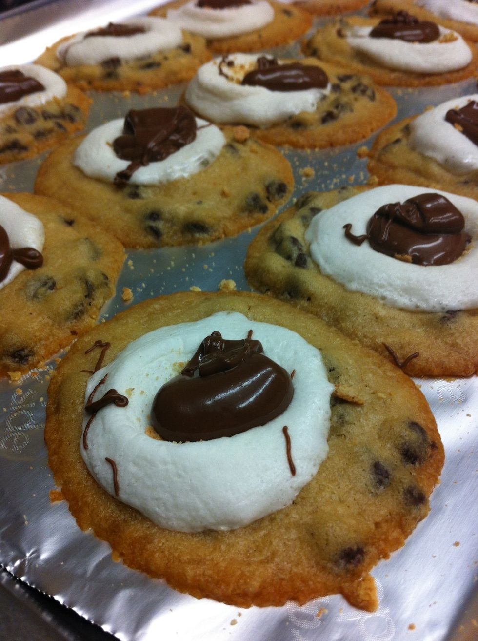 Spoon melted chocolate on top of the marshmallows and allow to cool in oven.