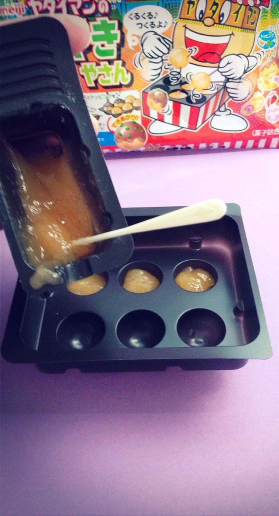 Spoon Mixture (yummy peach flavor) evenly into the 6 Octopus Ball molds