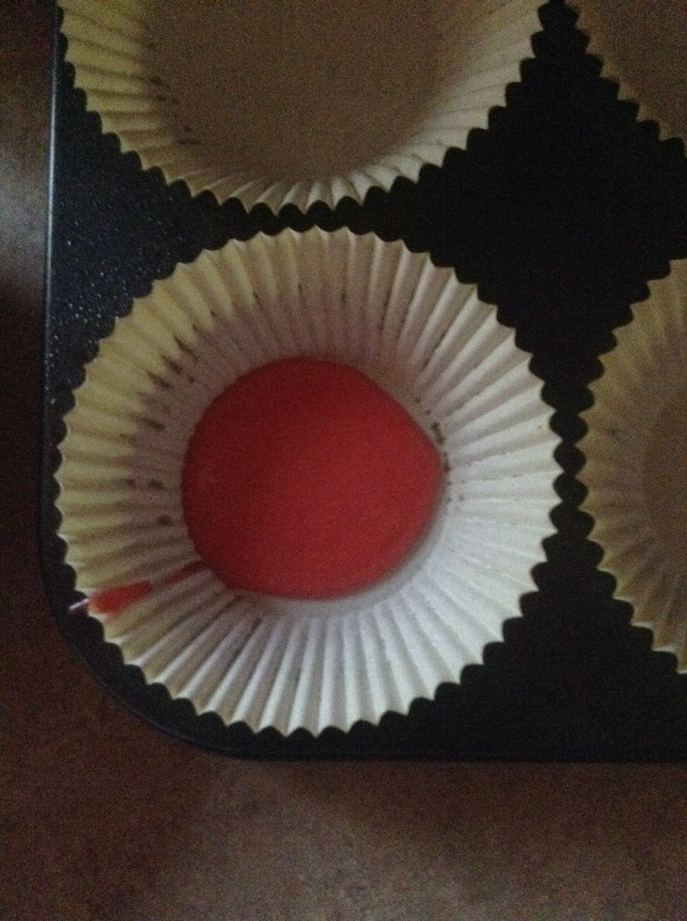 Spoon one teaspoon of red batter into a holder, let it spread out by itself