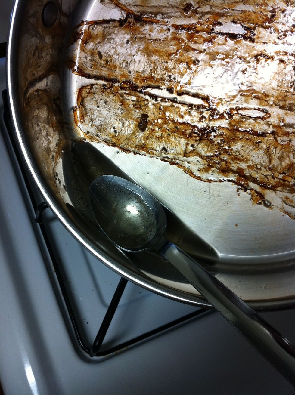 Spoon out some of the bacon grease leaving a little bit more than a tablespoon left in the skillet to cook the onions. Be sure to leave all that caramelized burnt-on-goodness (fond) in the pan.