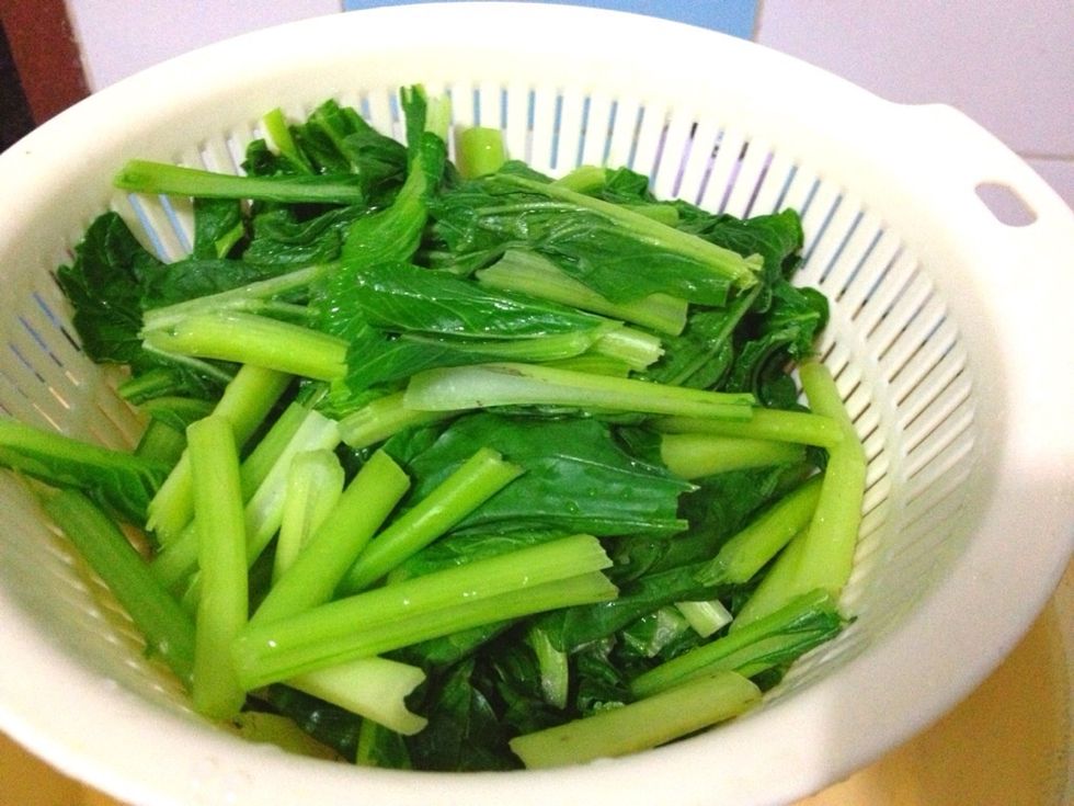 Spoon out the blanched choysim and put them on some ice or just simply quick wash them with iced-water to stop the cooking process. You will get a nice green color then