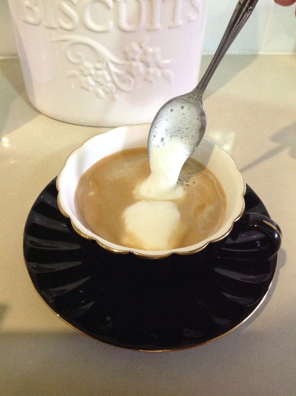 Spoon out the froth left behind in the bullet.