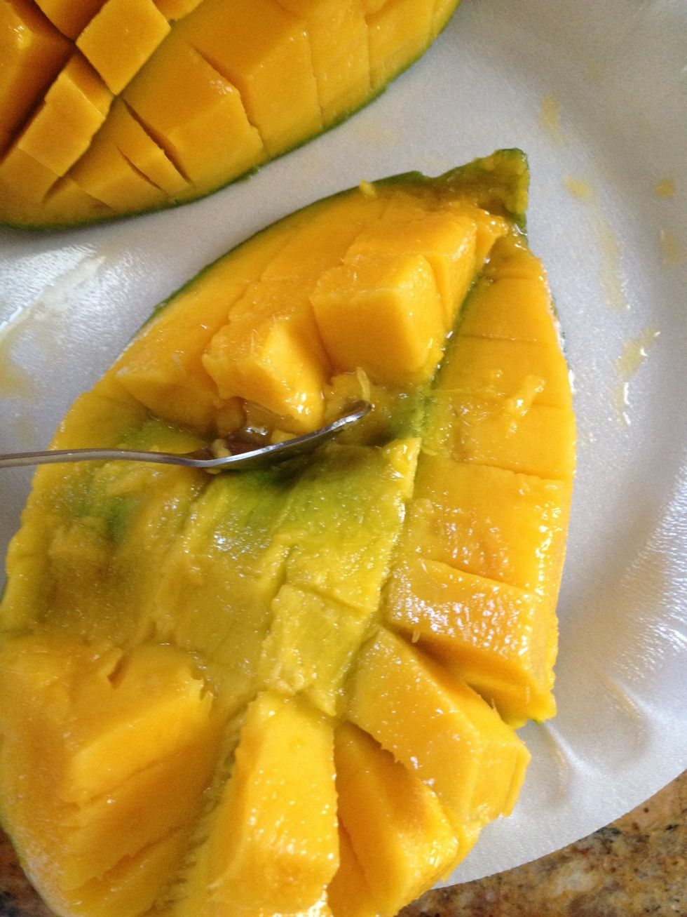 spoon out the mango cubes