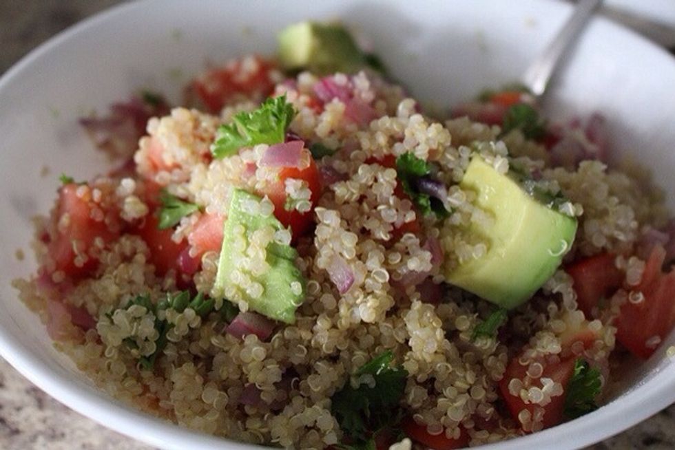 Spoon quinoa and avocado stuffing into empty avocado shells and serve immediately.