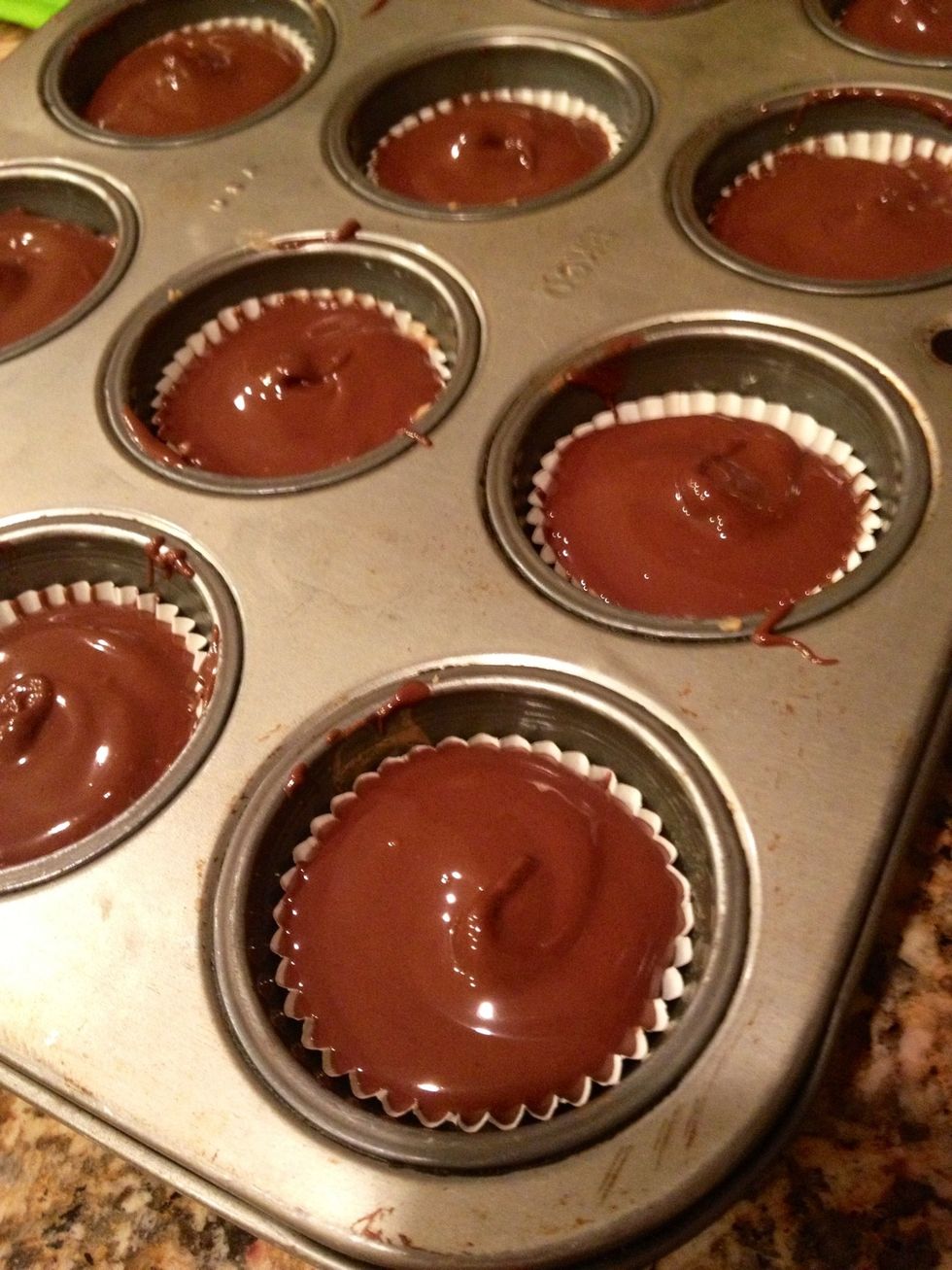 Spoon some more melted chocolate on top. Place the copycat Reese's cups in the fridge until the chocolate has set.