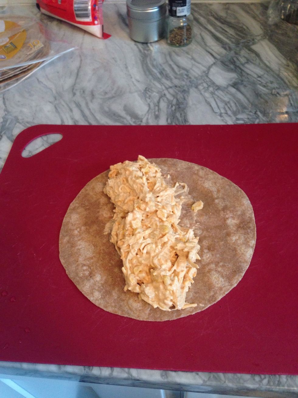 Spoon some of the mixture onto the tortilla.
