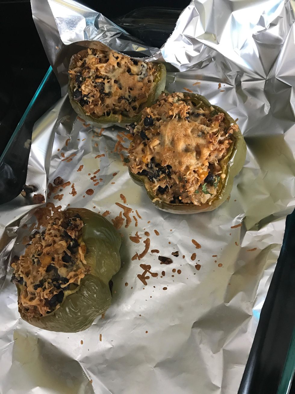 Spoon the filling into each bell pepper cavity. Place on prepared baking dish, cavity side up, and bake until the peppers are tender and the filling is heated through, about 25-30 minutes