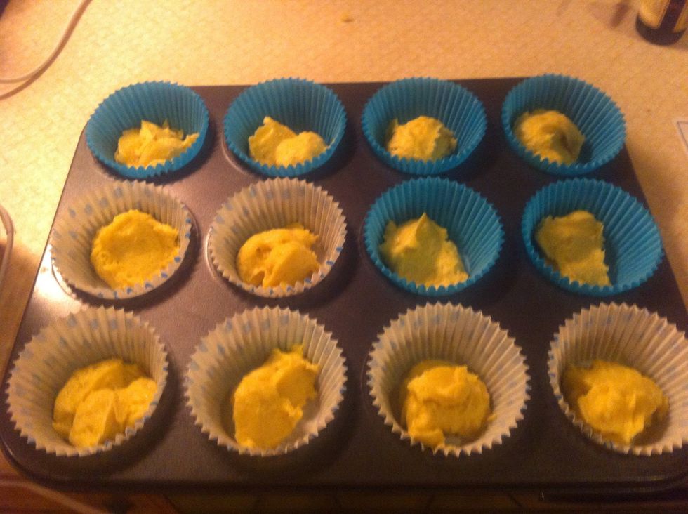 Spoon the mixture evenly into the 12 cakes and bake for 15 mins or until golden brown-