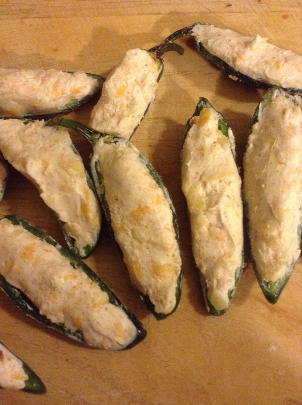 Spoon the mixture into the jalape\u00f1o halves.