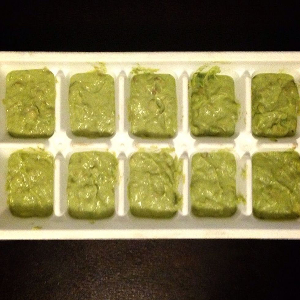 Spoon them into ice cube trays and cover with plastic wrap. Throw it in the freezer overnight.