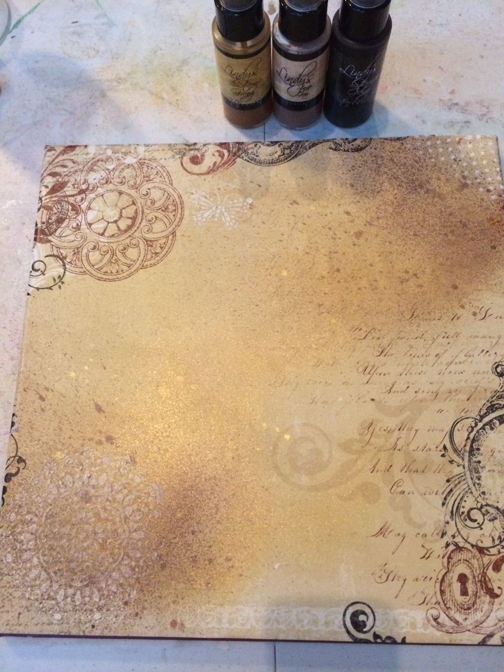 Spray 2 to 3 different colors of glimmer mist. I used Lindy's Stamp Gang for this project.