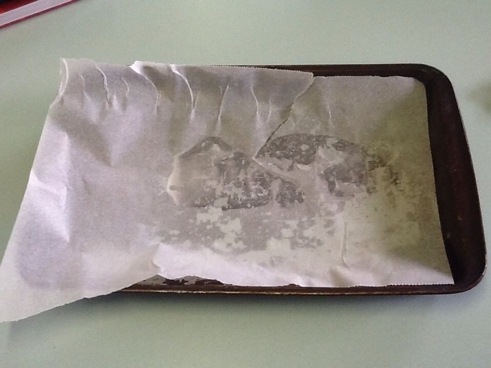 Spray a small baking tray with oil and then line it with baking paper.