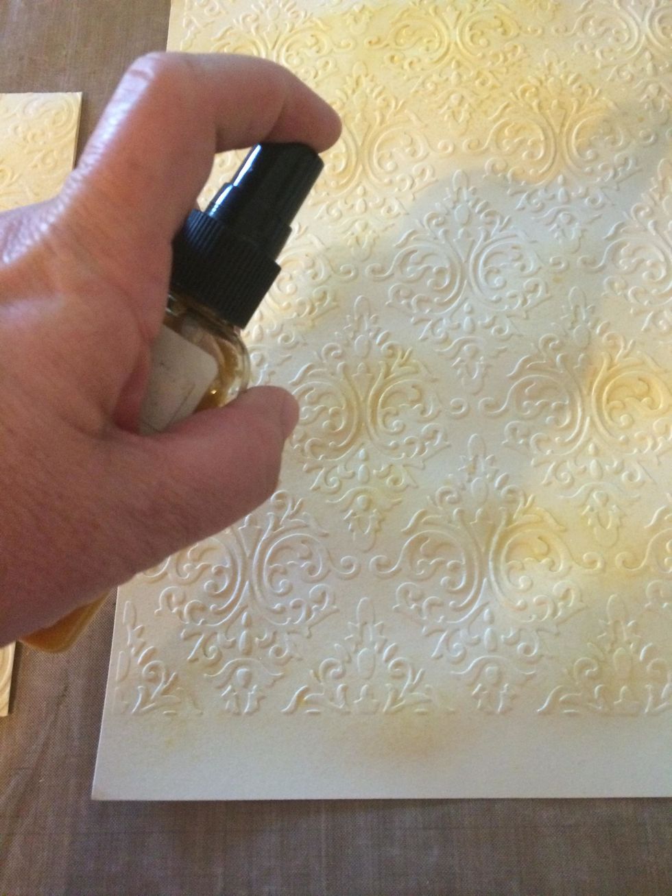 spray all embossed pieces with sparkly mist (gold)