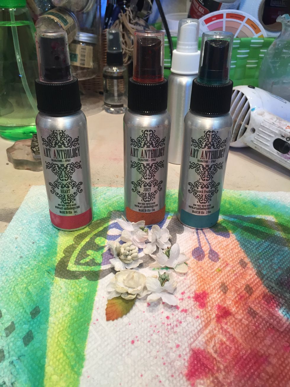 Spray another batch of flowers with Wild Orchid, Heart, and Juicy Colorations.  When dry, mist with Sterling Fairy Dust and place in top left corner.