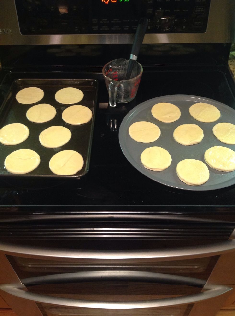 Spray baking pans and place the circles onto the pans; then brush the melted butter onto the circles