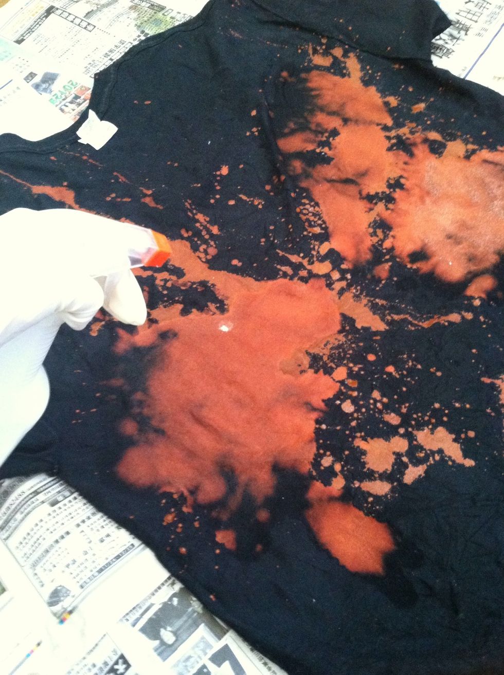 Spray bleach and water solution liberally on your shirt. It should look like this.