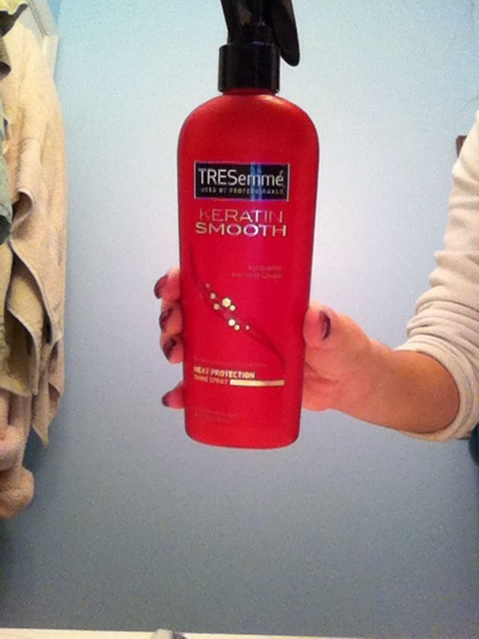 Spray both sides with your choice of heat protectant, wait a few seconds, and then brush.