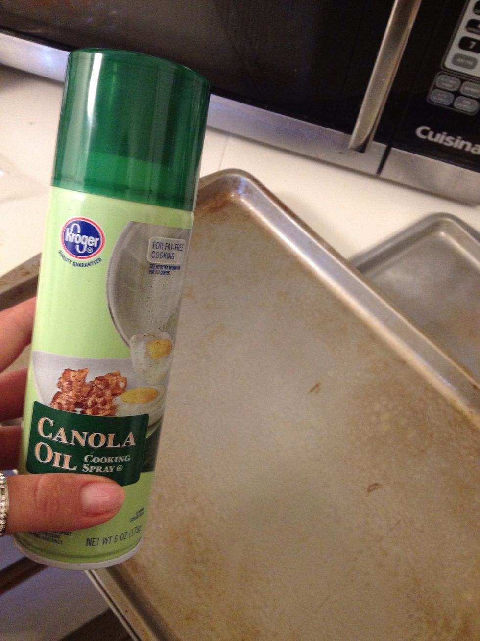 Spray cookie sheet with canola oil