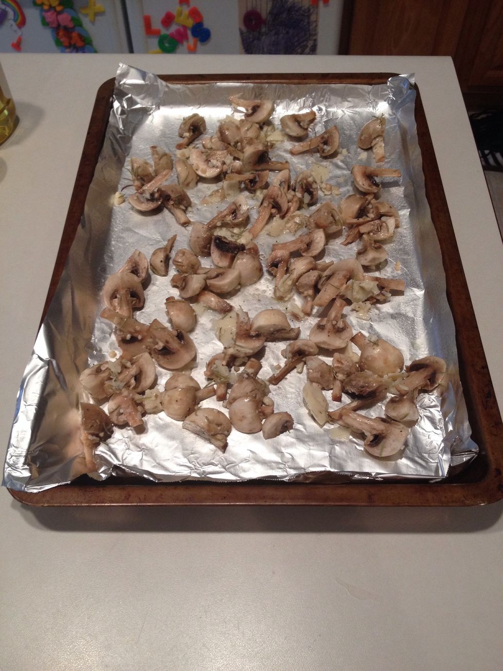 Spray foil covered pan with nonstick cooking spray and add mushrooms, spreading out over pan.
