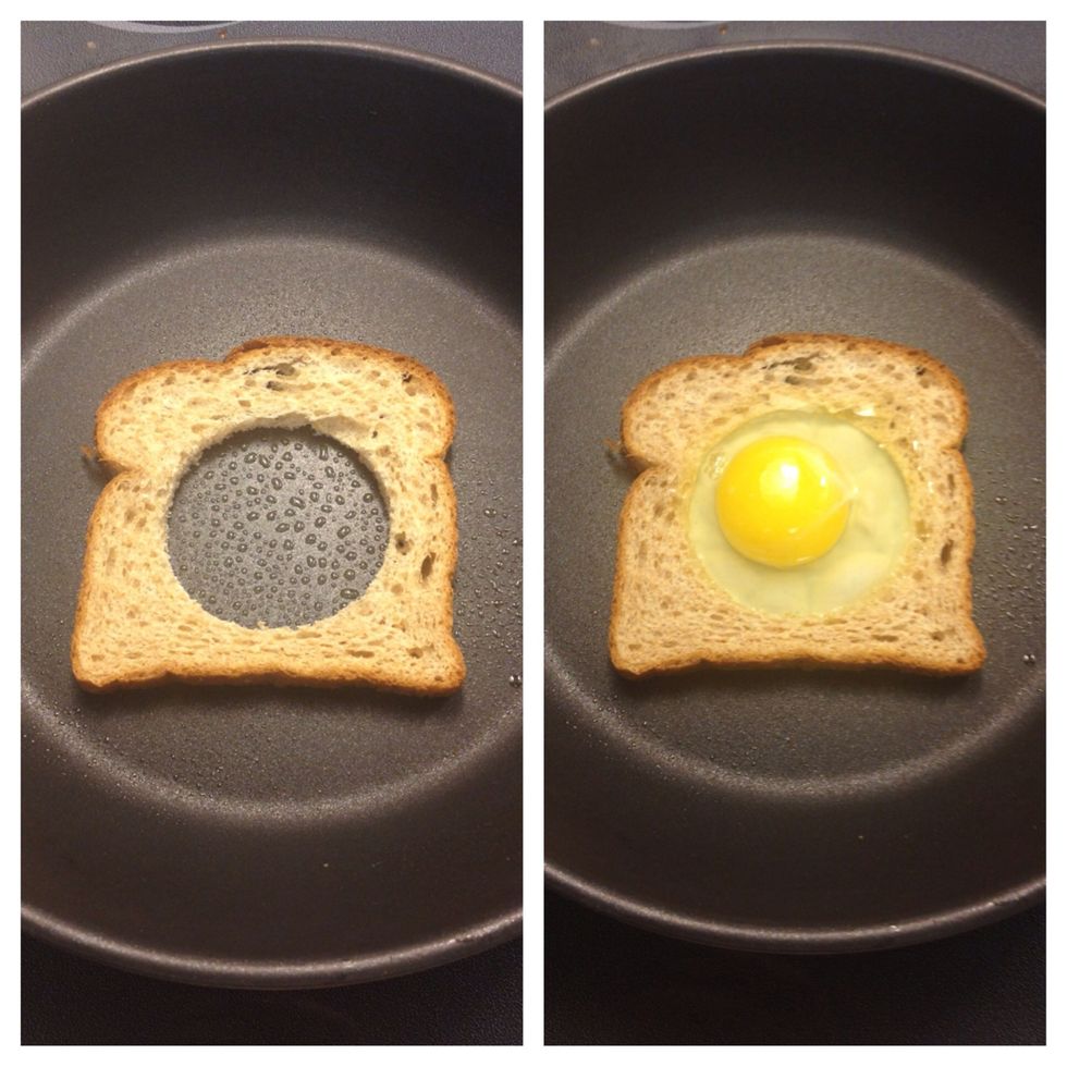 Spray frying pan with cooking spray. Put the cut slice of bread in the hot pan. Gently add egg into the center reservoir. (Omit yolk for a healthy choice.) Egg should sizzle gently as it cooks.