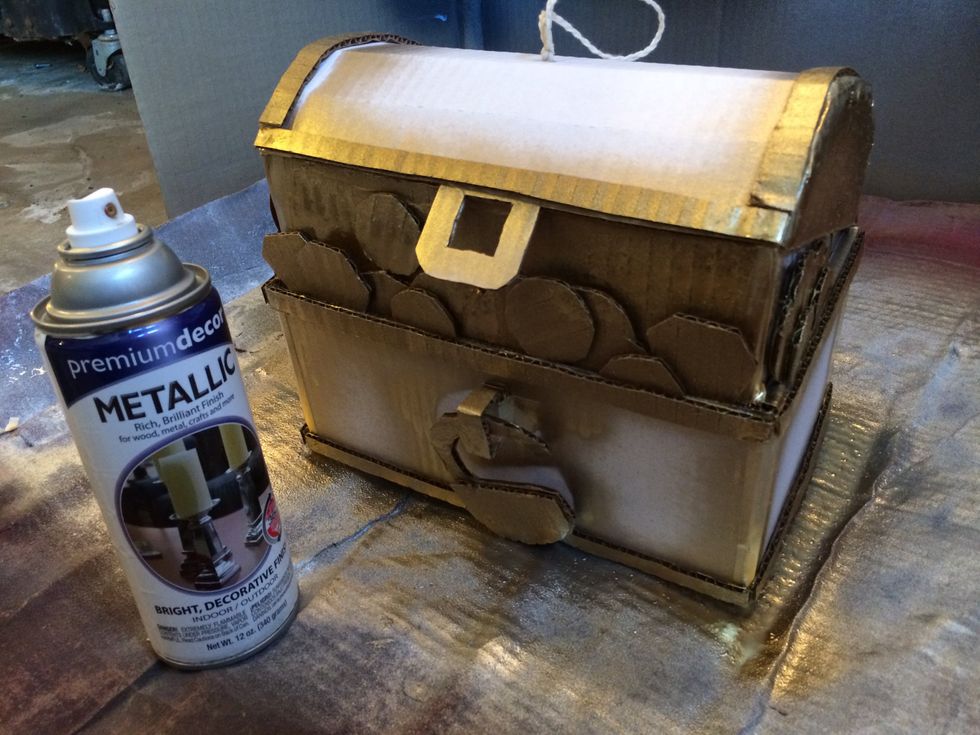 Spray gold on all the edge "bands," the latch, lock, corners, and the "coins" inside.