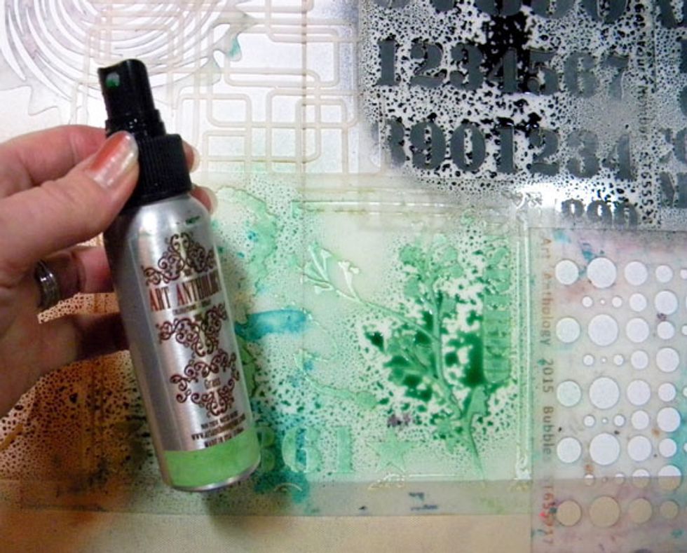 Spray Grass on the Inspired Grunge stencil. I overlapped the stencils on the paper, so my images will be random and messy.