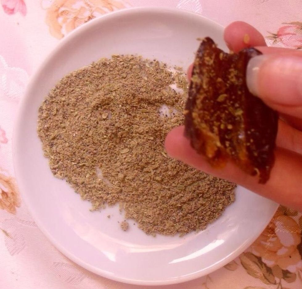 Spray ground cardamom inside date