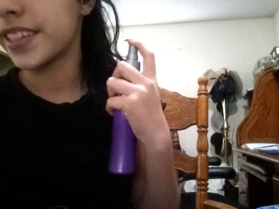 Spray in heat protecter and brush it out :)