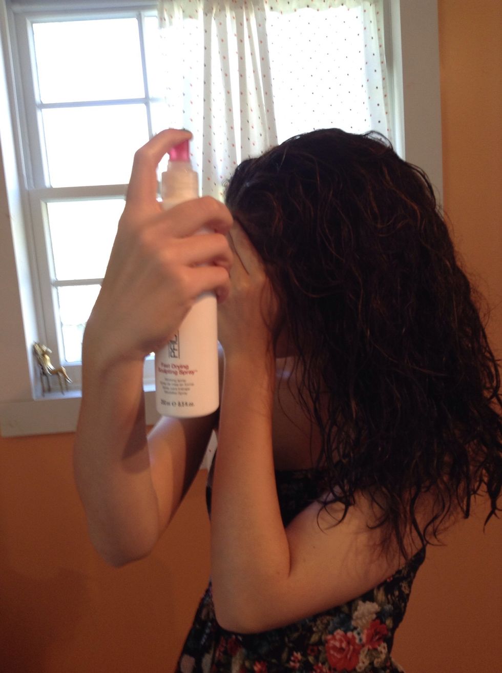 Spray in some hair spray. Not too much, just a bit in the front and back.