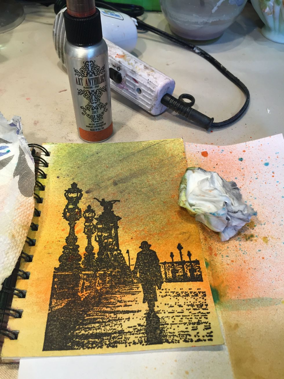 Spray Juicy in the middle of the page then wipe with a baby wipe.