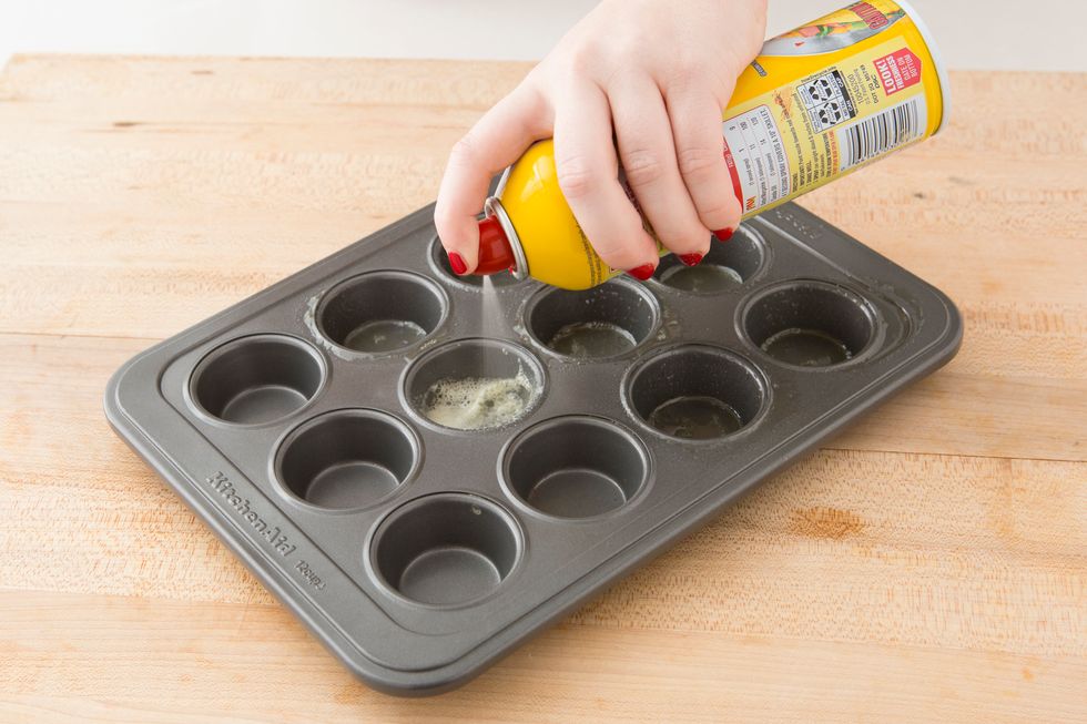 Spray mini muffin tins with cooking spray.