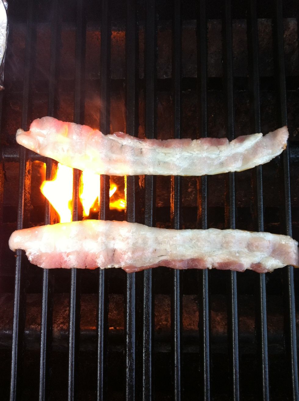 Spray oil grill grates and add bacon. Grill 3-4 minutes.