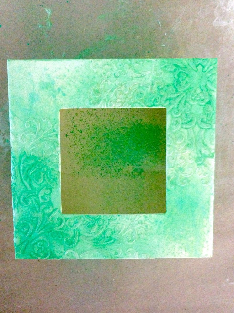 Spray onto the flourishes again to darken the intensity...