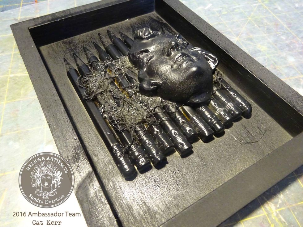 Spray paint entire piece in black