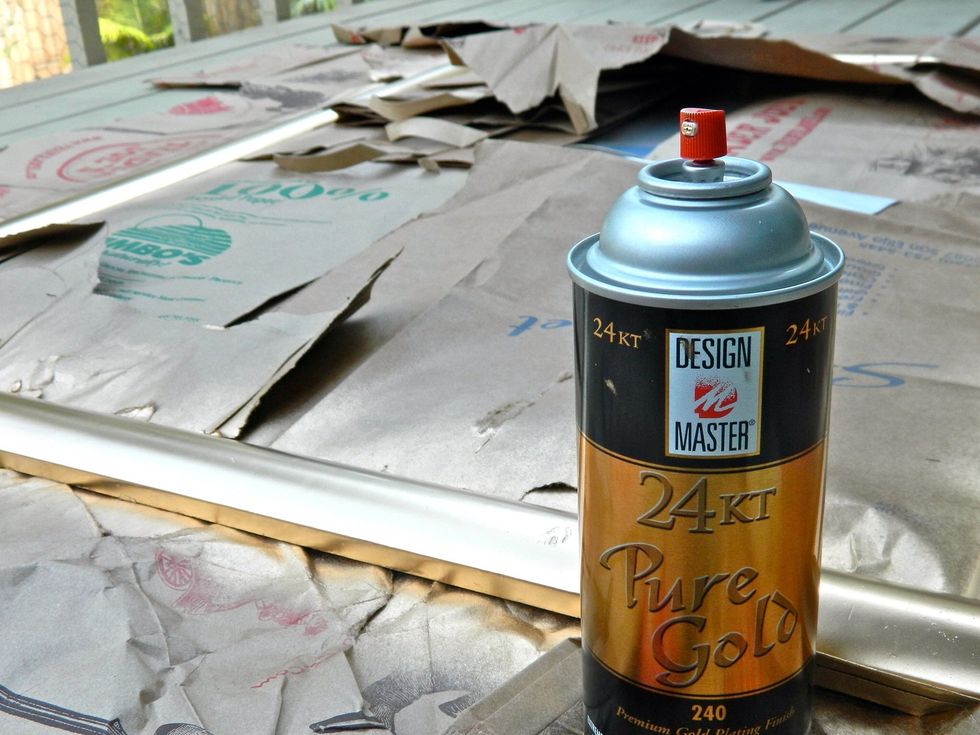Spray paint your frame, covering the glass and the floor underneath. Let dry.