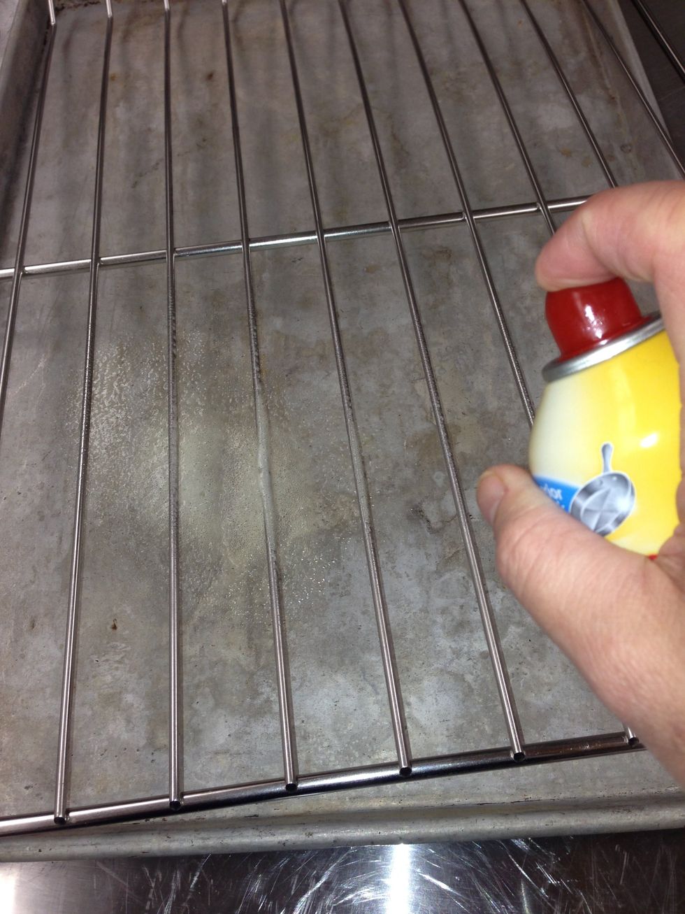 Spray pan release spray onto the chicken racks.