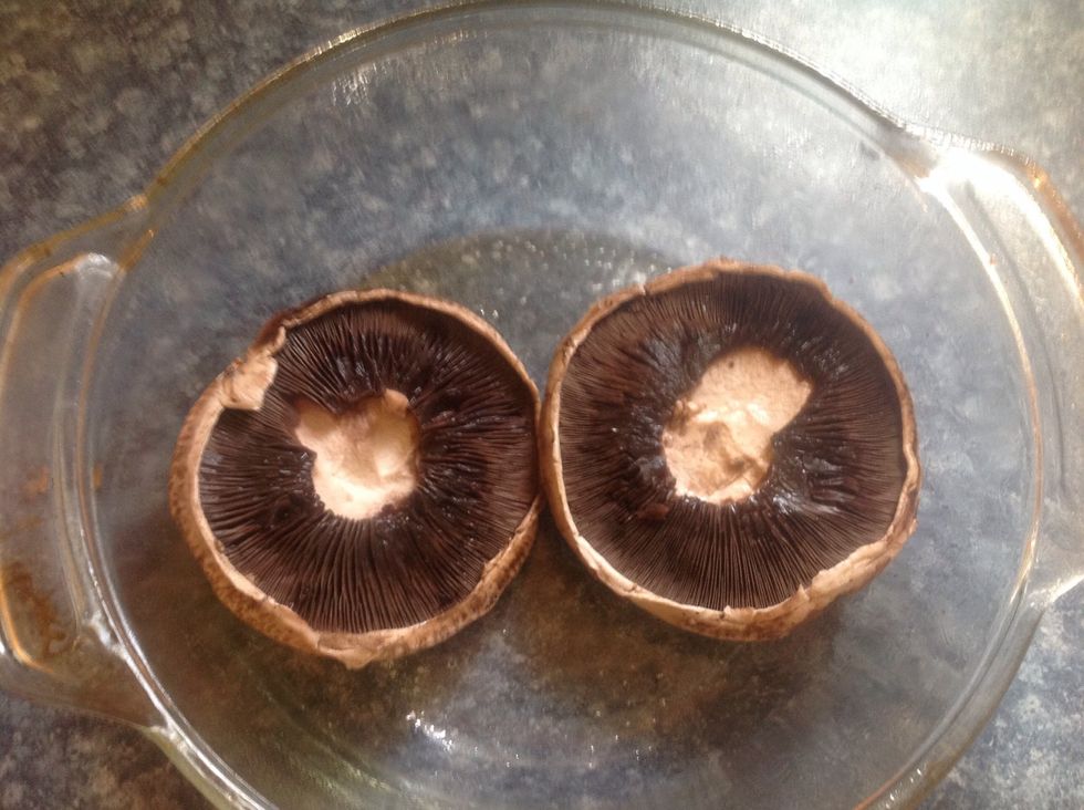 Spray pan with Pam and place mushrooms in.