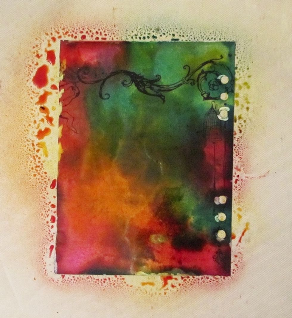 Spray randomly on the first page. Let it dry.